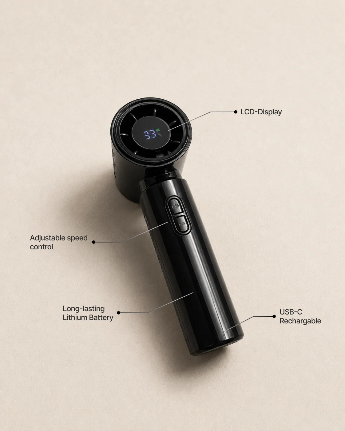 Glossy black rechargeable CoolWave fan on an ivory textured surface