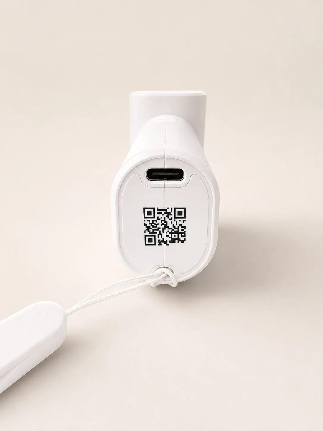 CoolWave handheld fan with a QR code printed on the body